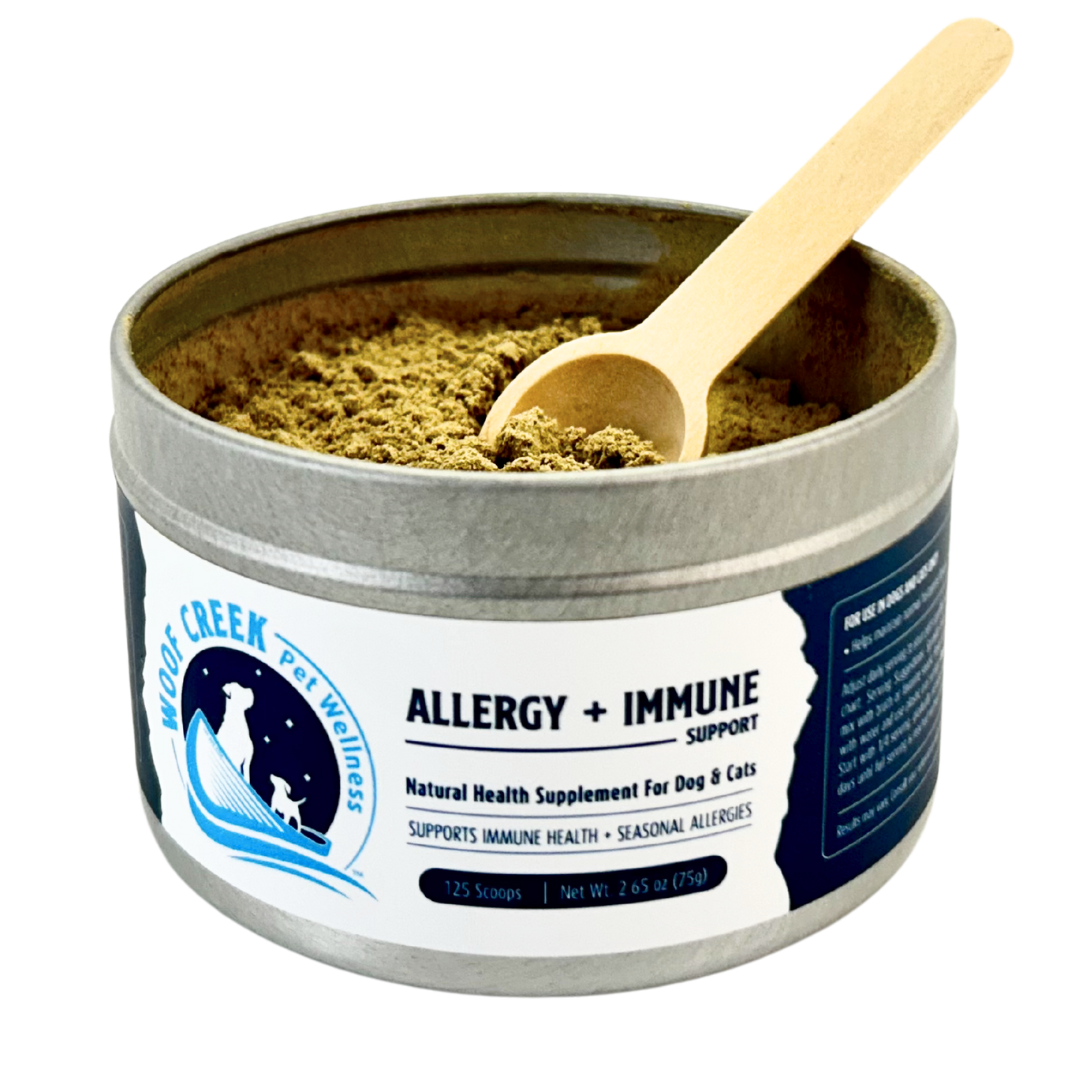 Tin of natural health supplement for pets with a wooden scoop on a white background