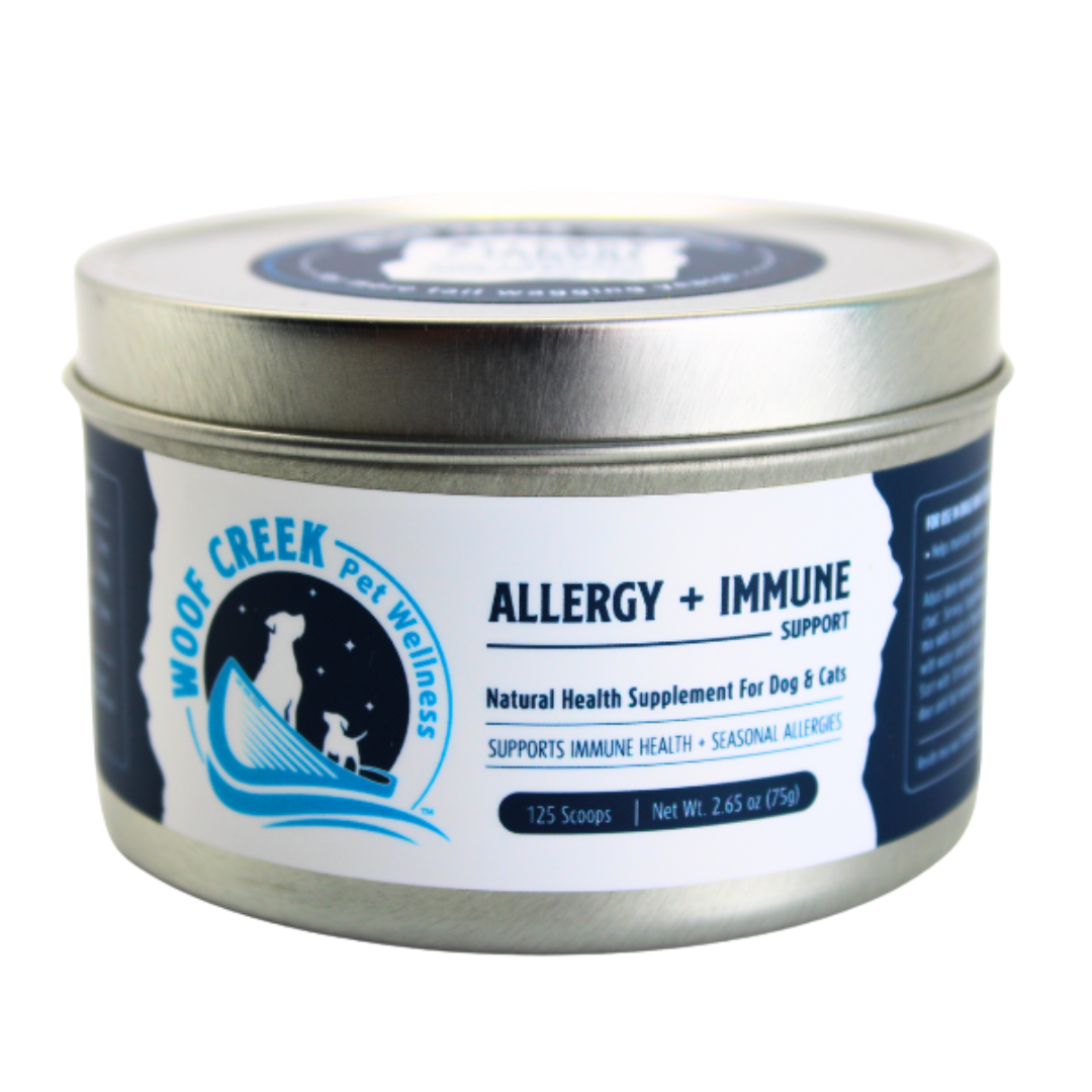 Tin labeled 'Woof Creek Pet Wellness' for allergy and immune support on a white background