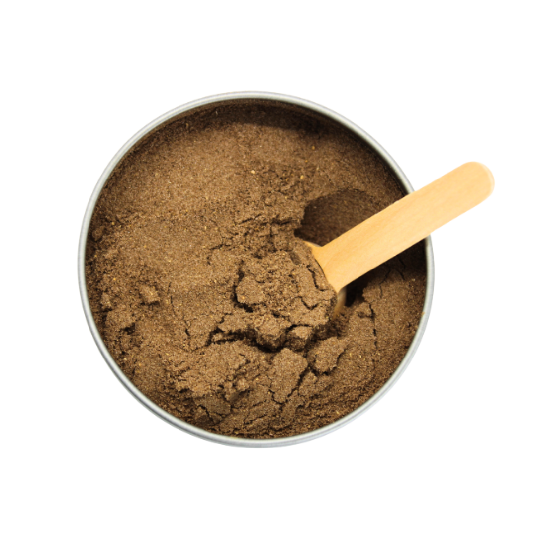 Brown powder in a metal container with a wooden scoop on a white background
