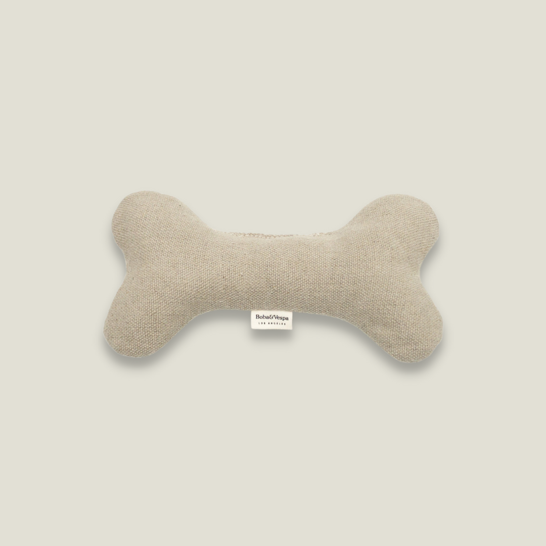 A hemp bone for dogs in a taupe canvas material.