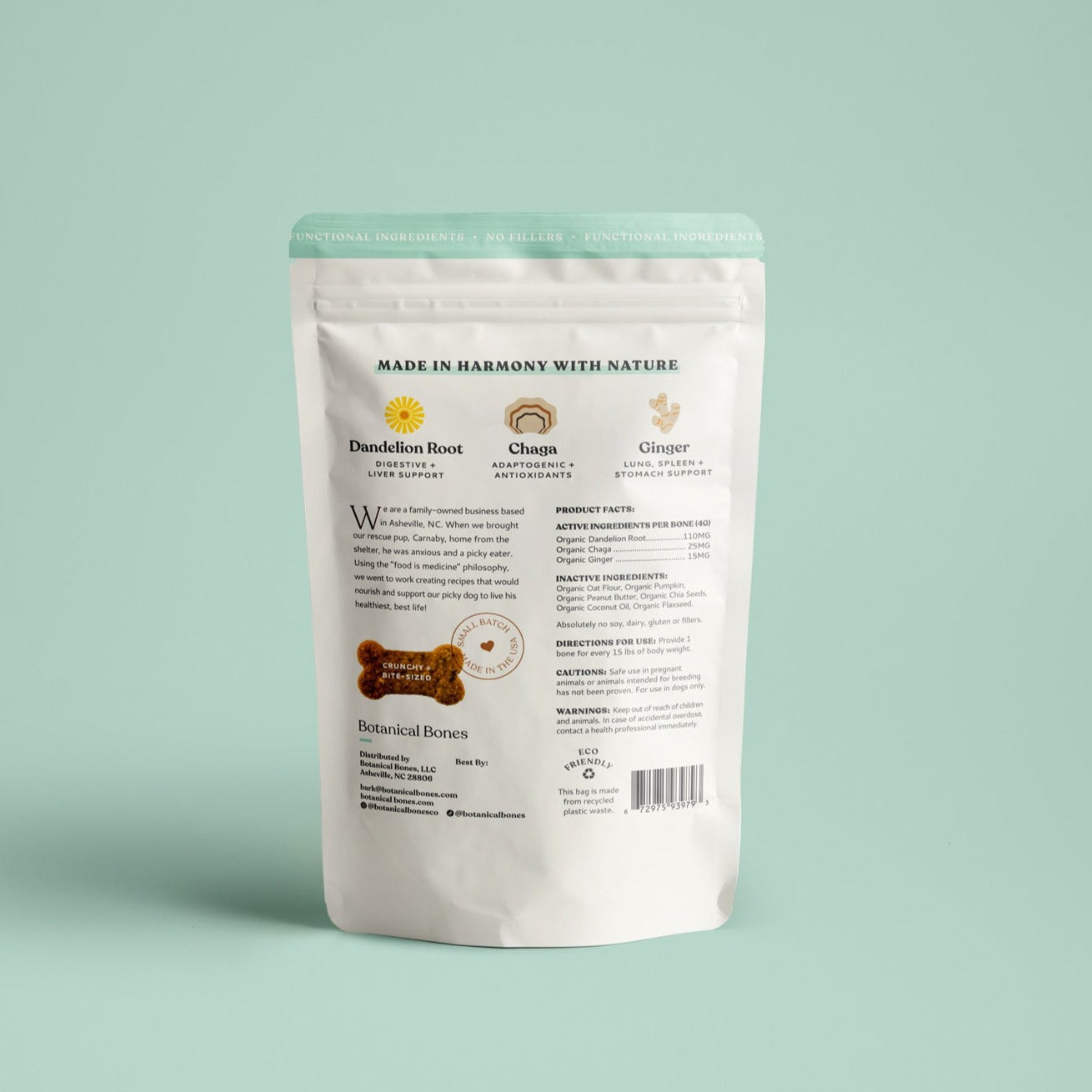 Back side of white packaging with text and graphics on a light green background. Talks about the ingredients used in these dog digestive treats for sensitive stomachs.