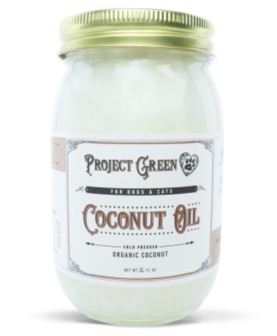 Jar of cold pressed, organic coconut oil on a white background