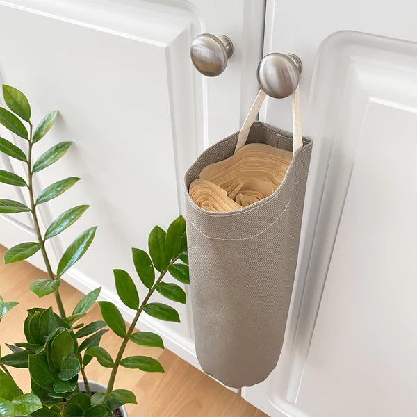 Cat Litter Bag Holder hanging on cupboard