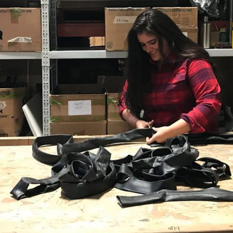 Woman cutting up rubber for products