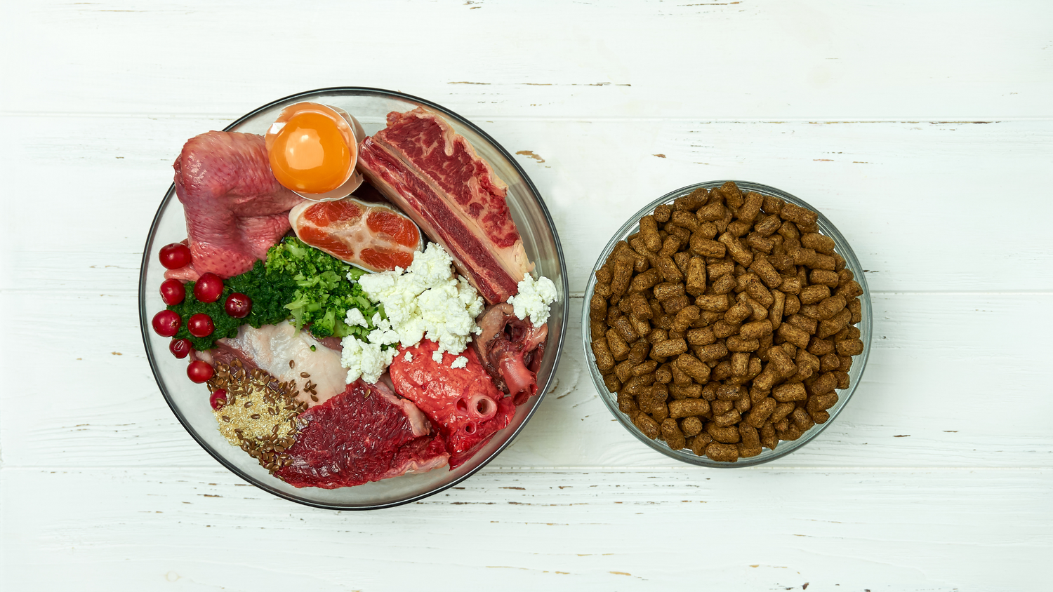 bowl of fresh kibble boosters next to bowl of dry kibble