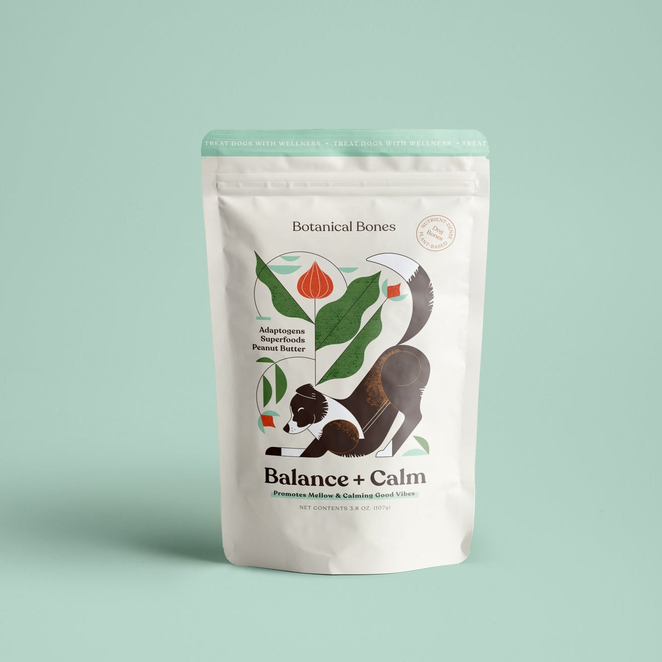 White packaging of 'Botanical Bones' calm treats for puppies and dogs with illustrations and text on a light green background