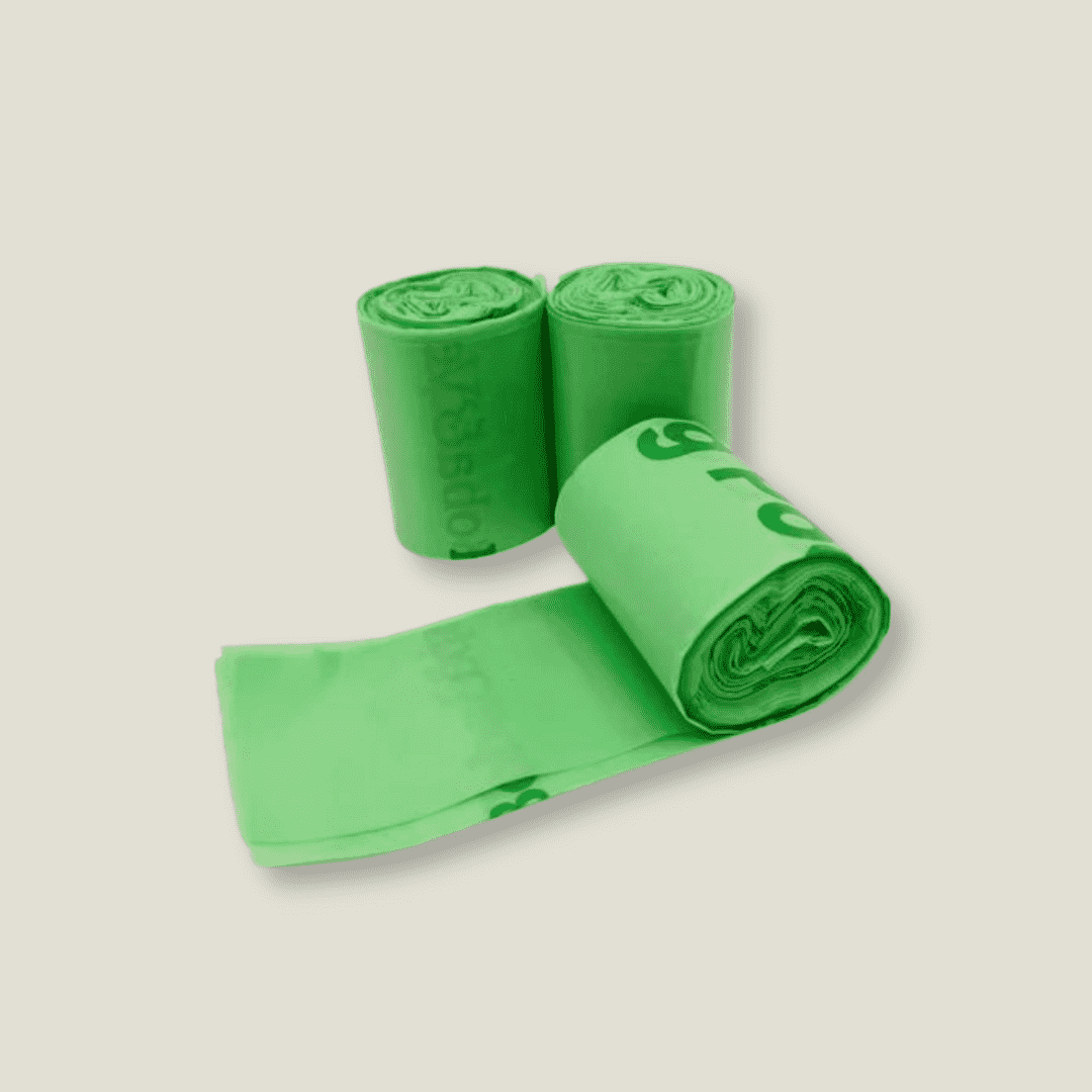 three rolls of green compostable dog poop bags made in usa