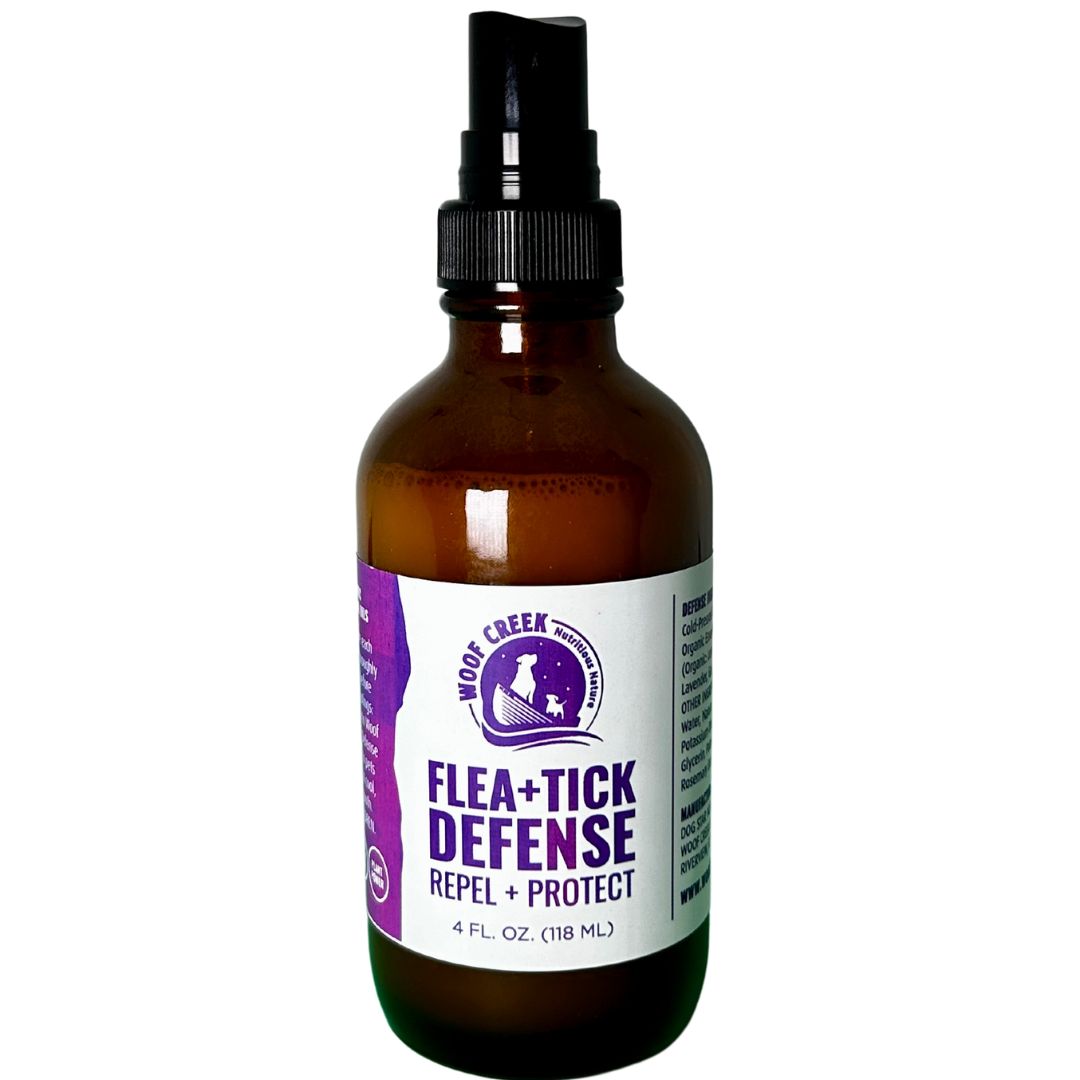 Brown spray bottle with purple label on a white background