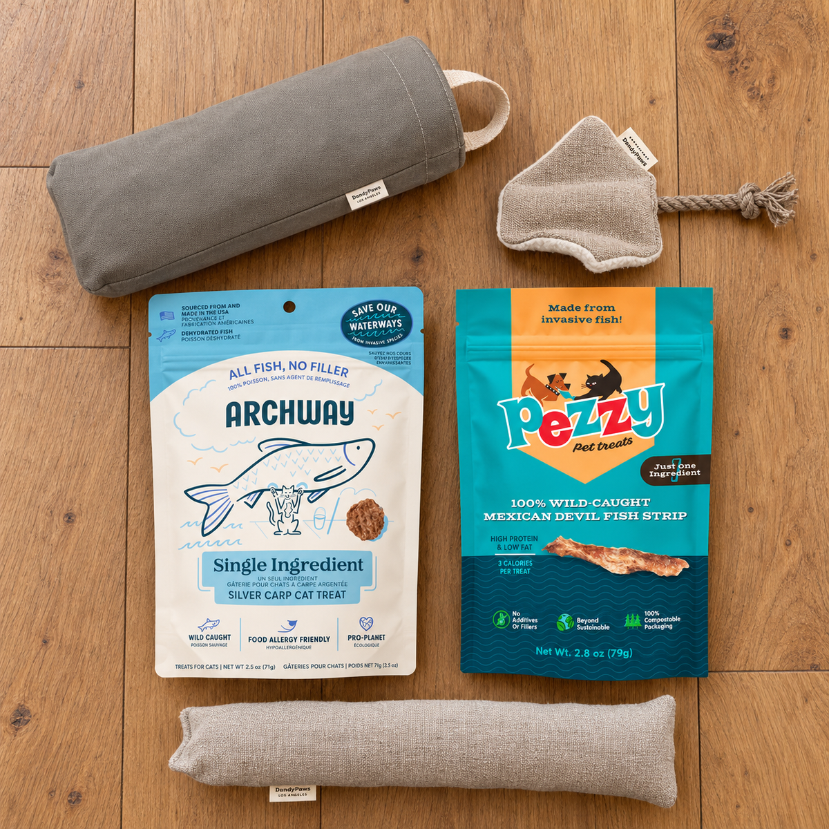 five cat items laying on a wood floor
